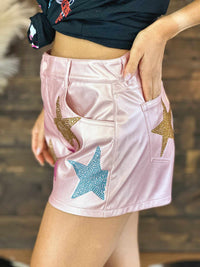 Thumbnail for LIght pink metallic leather shorts with stars.