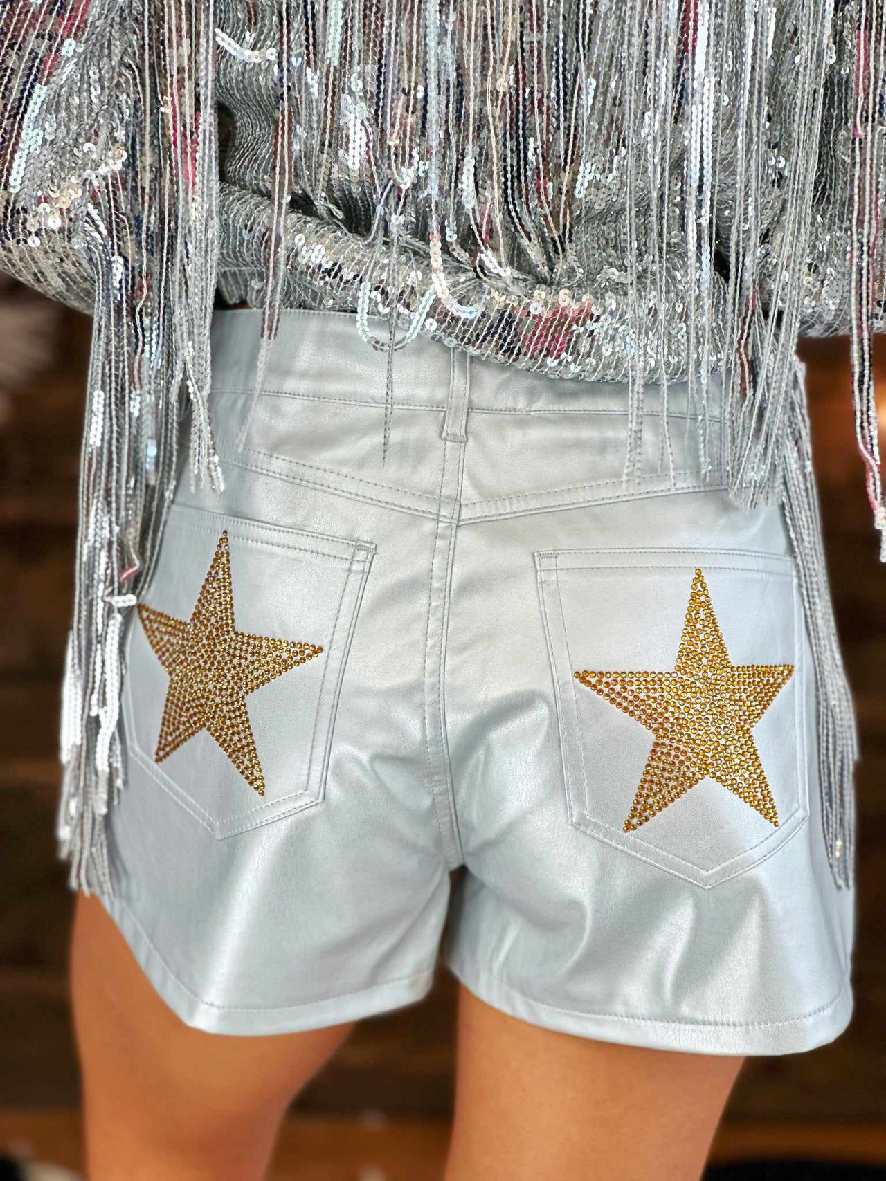 Faux leather metallic shorts with stars.