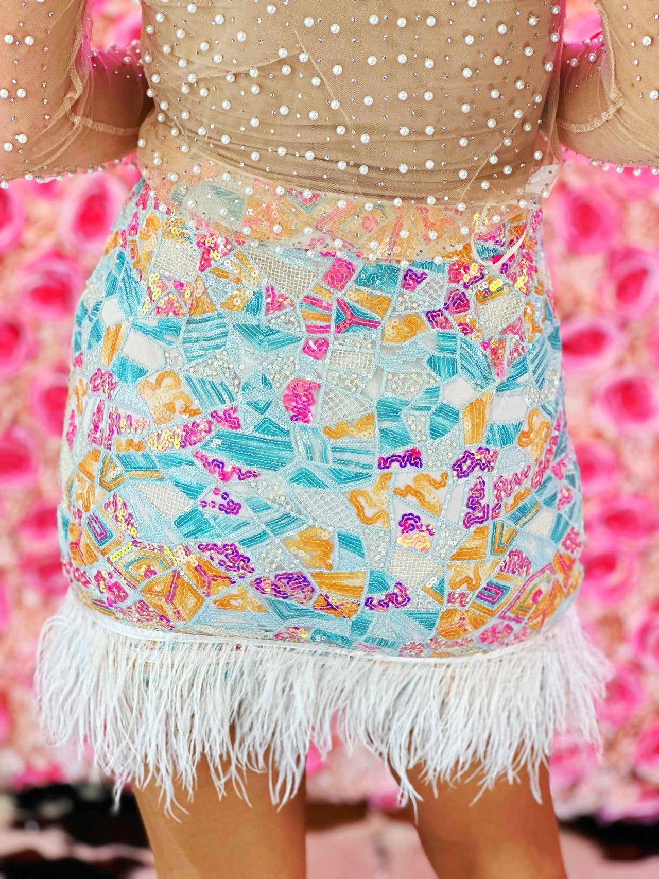 Patterned sequin mini skirt with feather hem