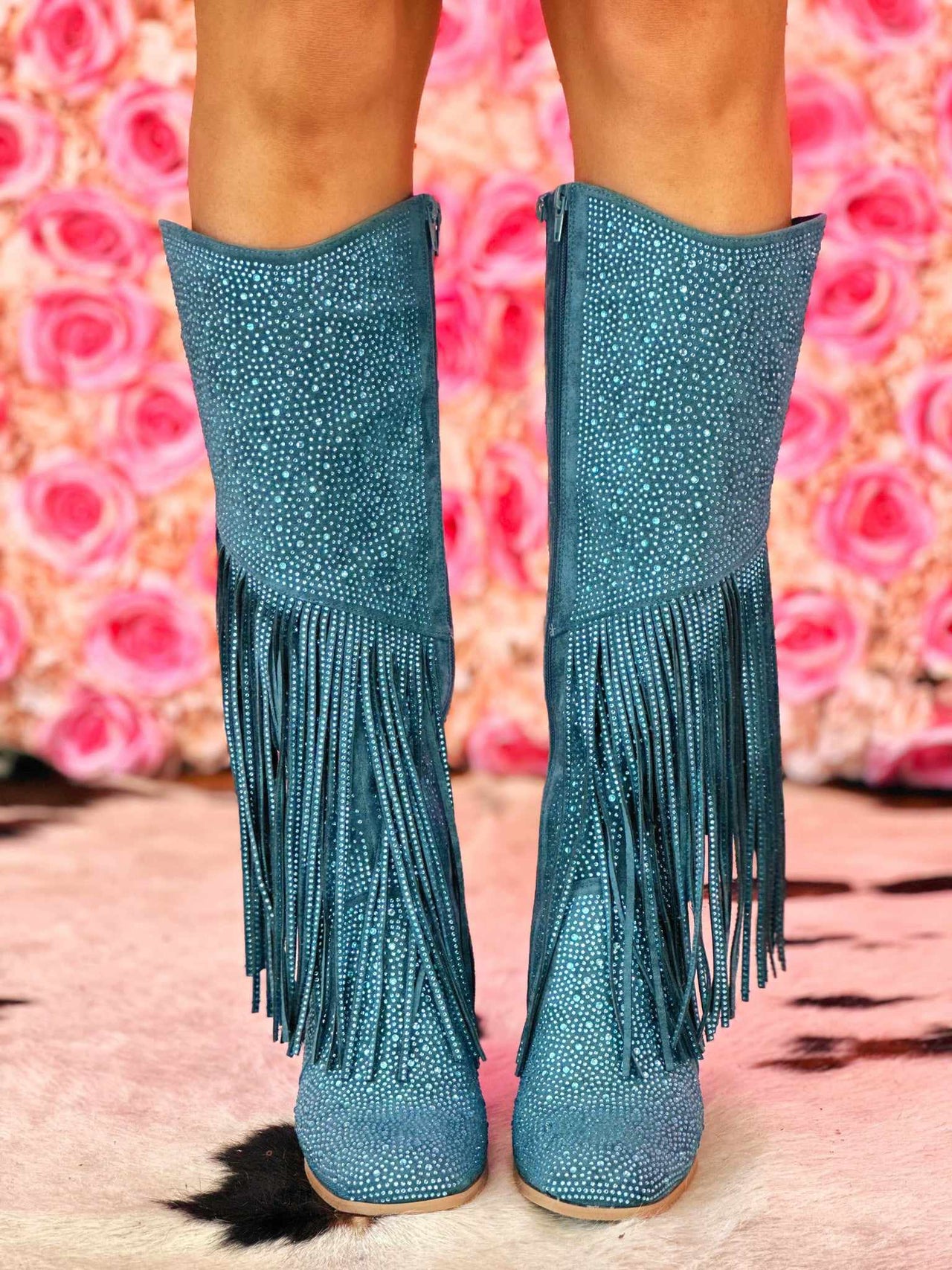 Blue cowgirl boots with fringe and rhinestones