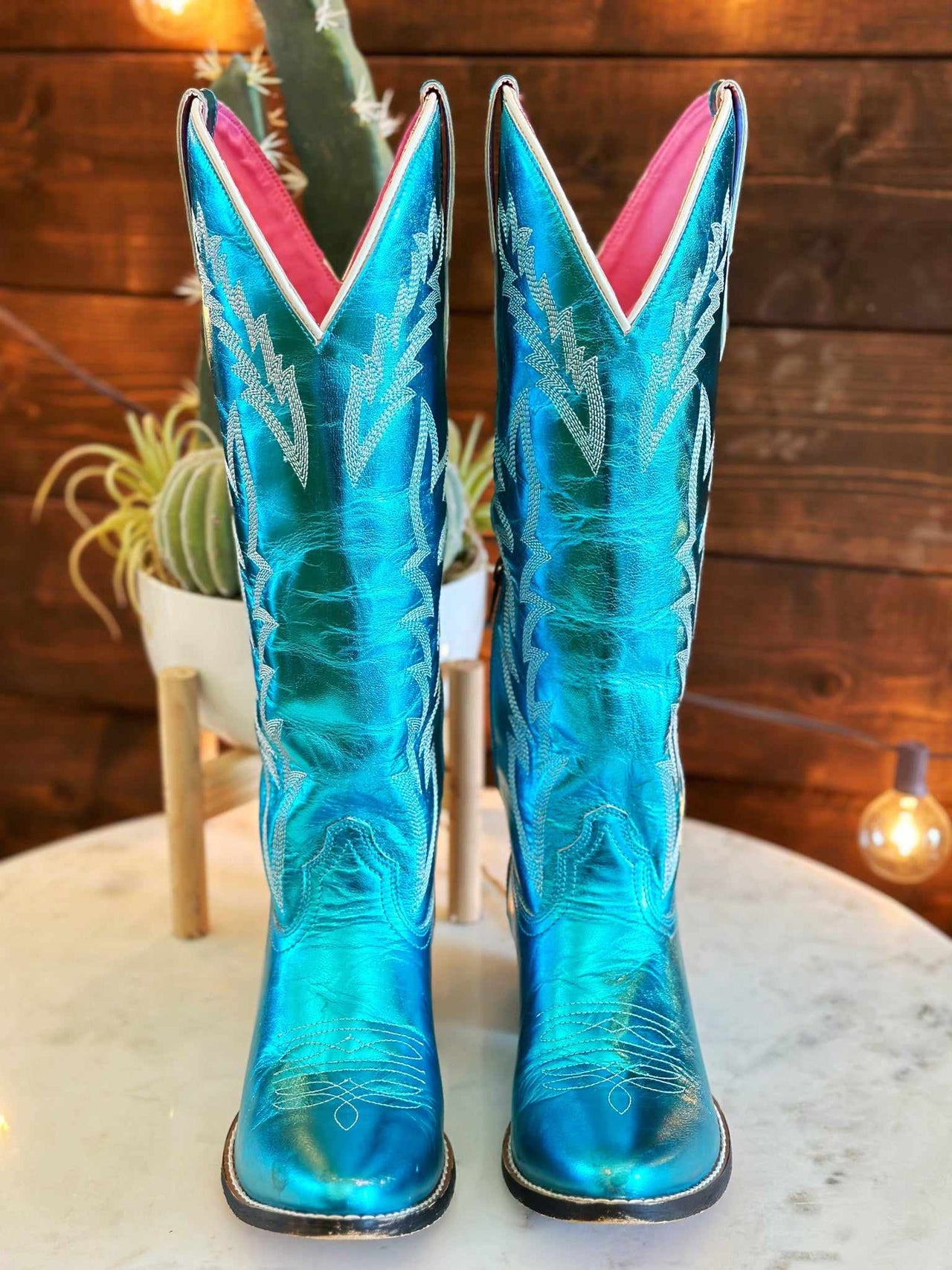 Womens western boots in metallic turquoise.