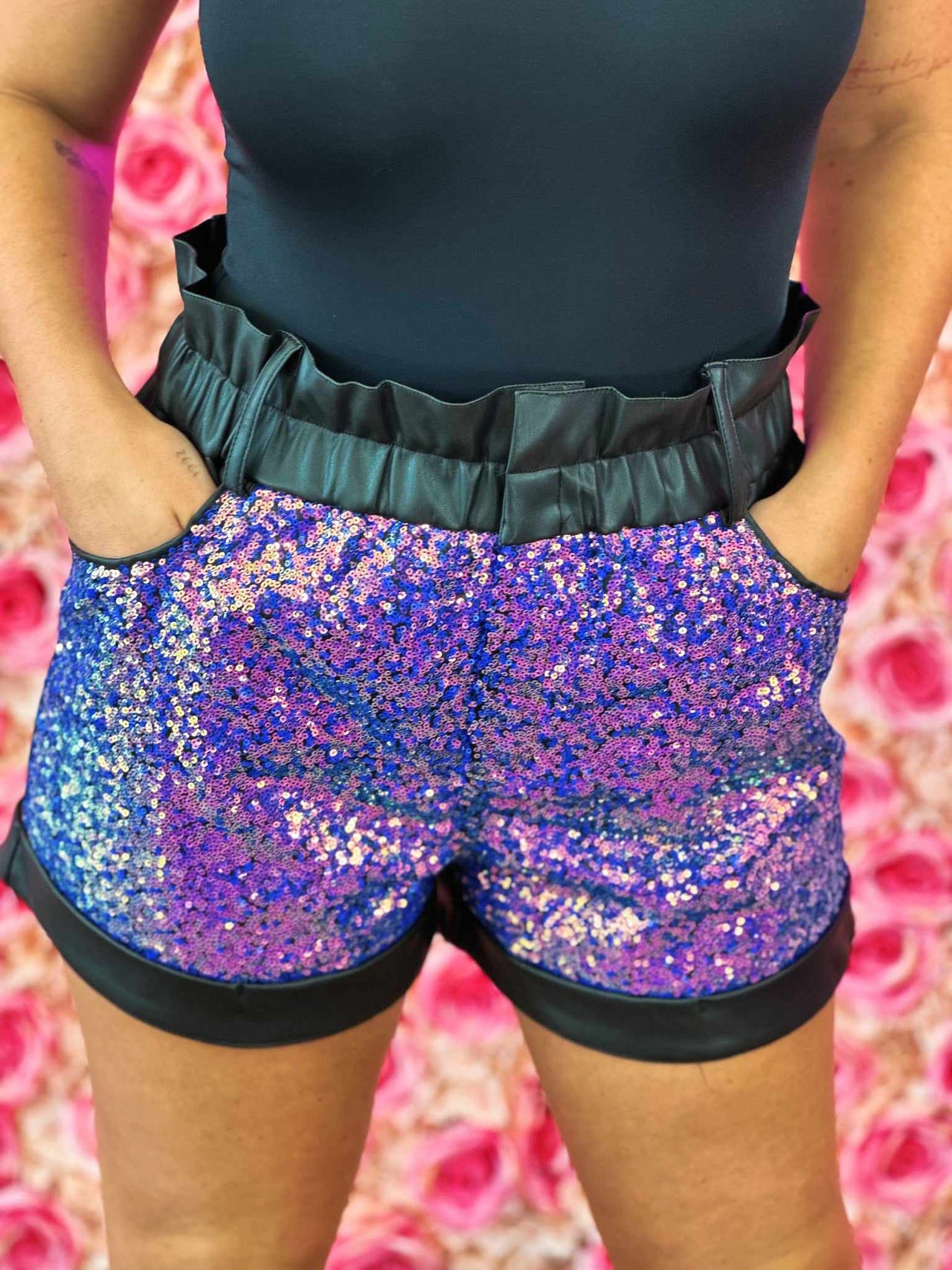 Black faux leather shorts with purple sequins