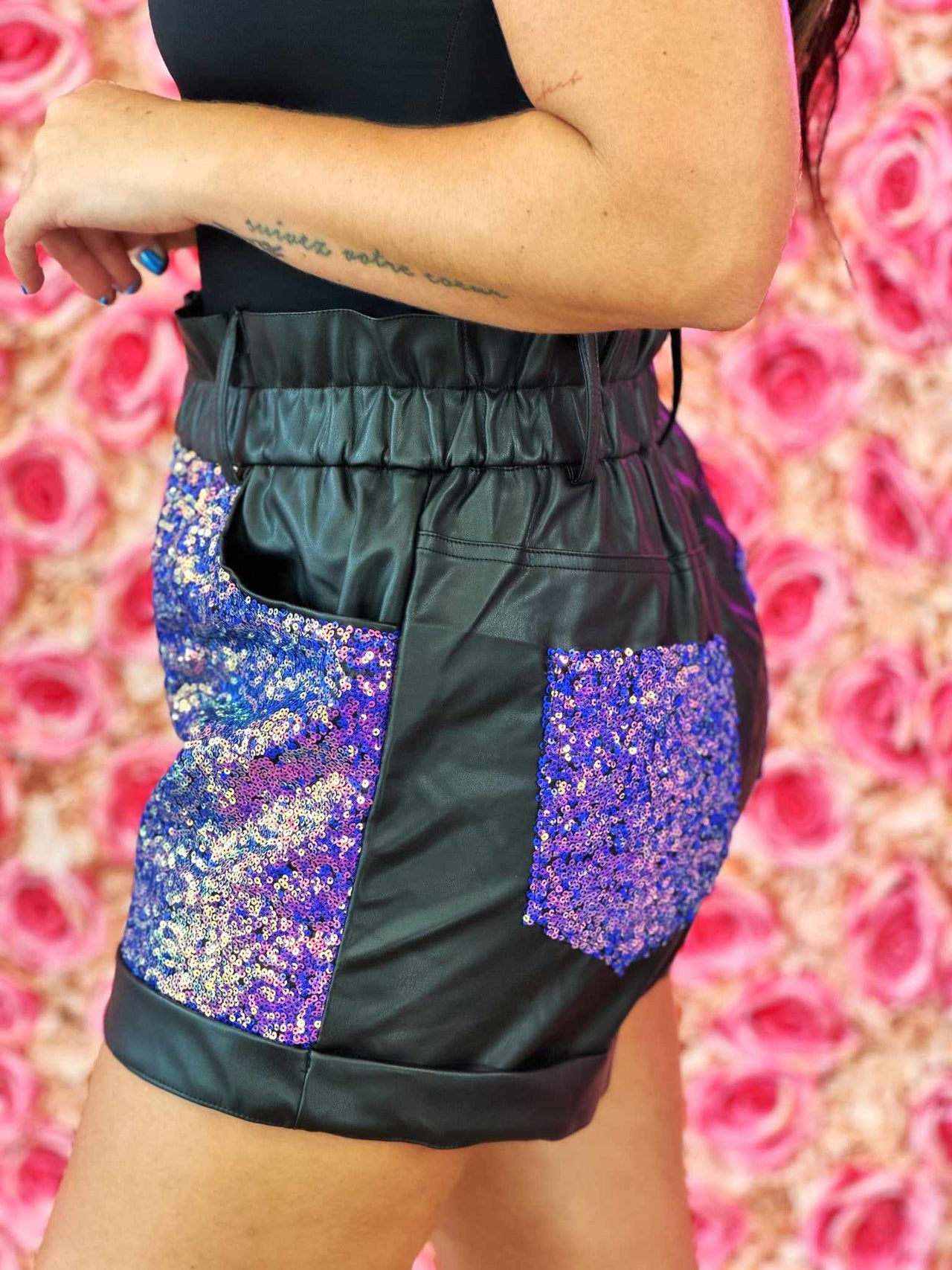 Black faux leather short with purple sequins