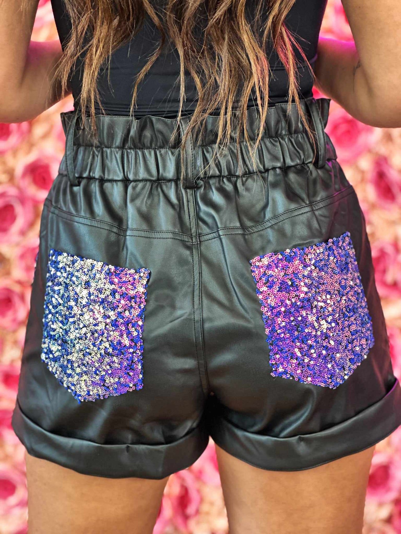 Black faux leather shorts with purple sequins
