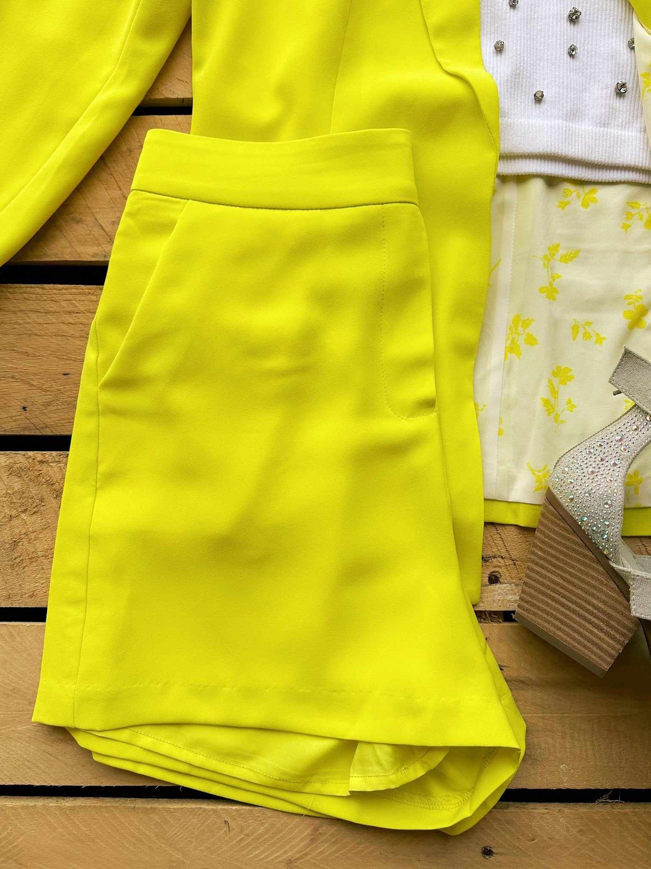 Flowy yellow flat front shorts.