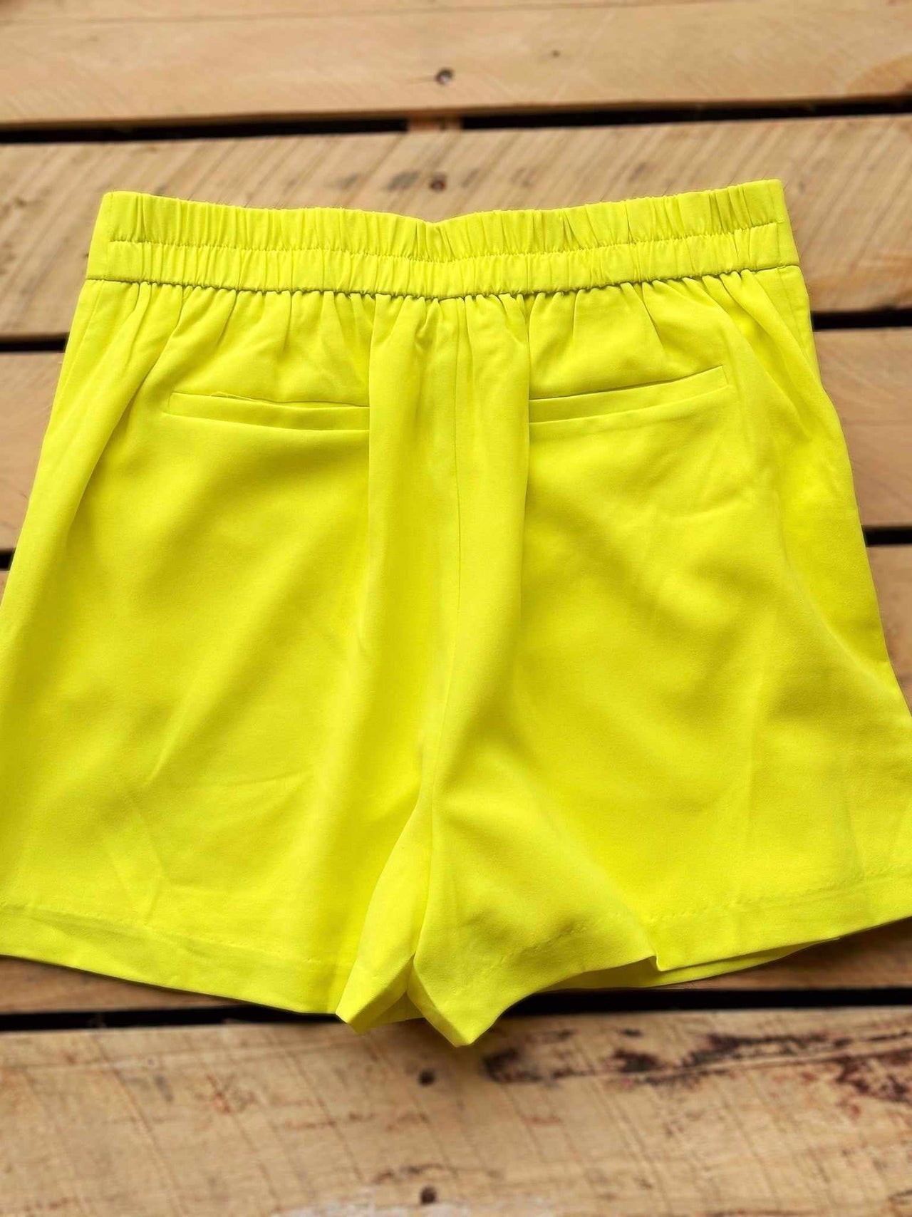 Elastic waist flat front shorts in yellow