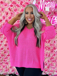 Thumbnail for Oversized pink sweater.