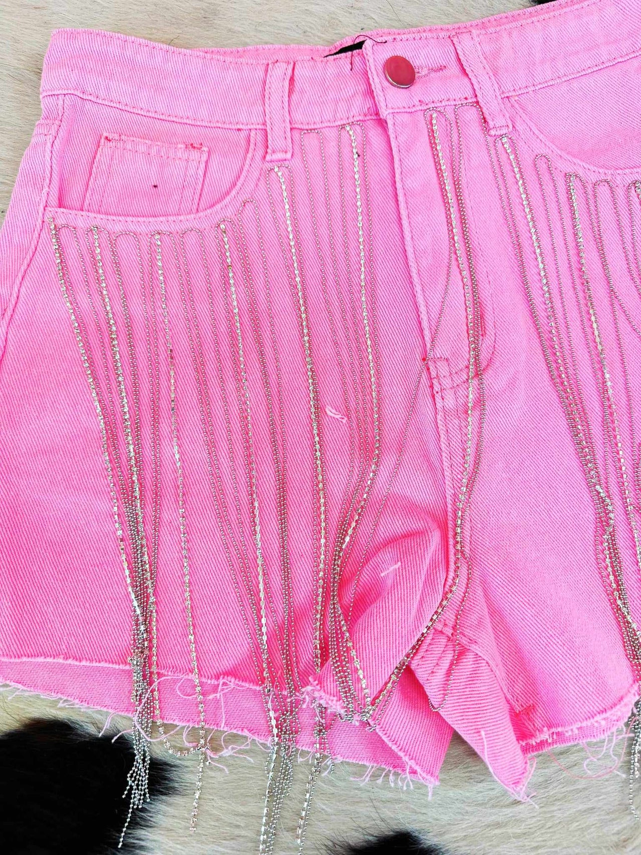 Pink jean shorts with rhinestone fringe