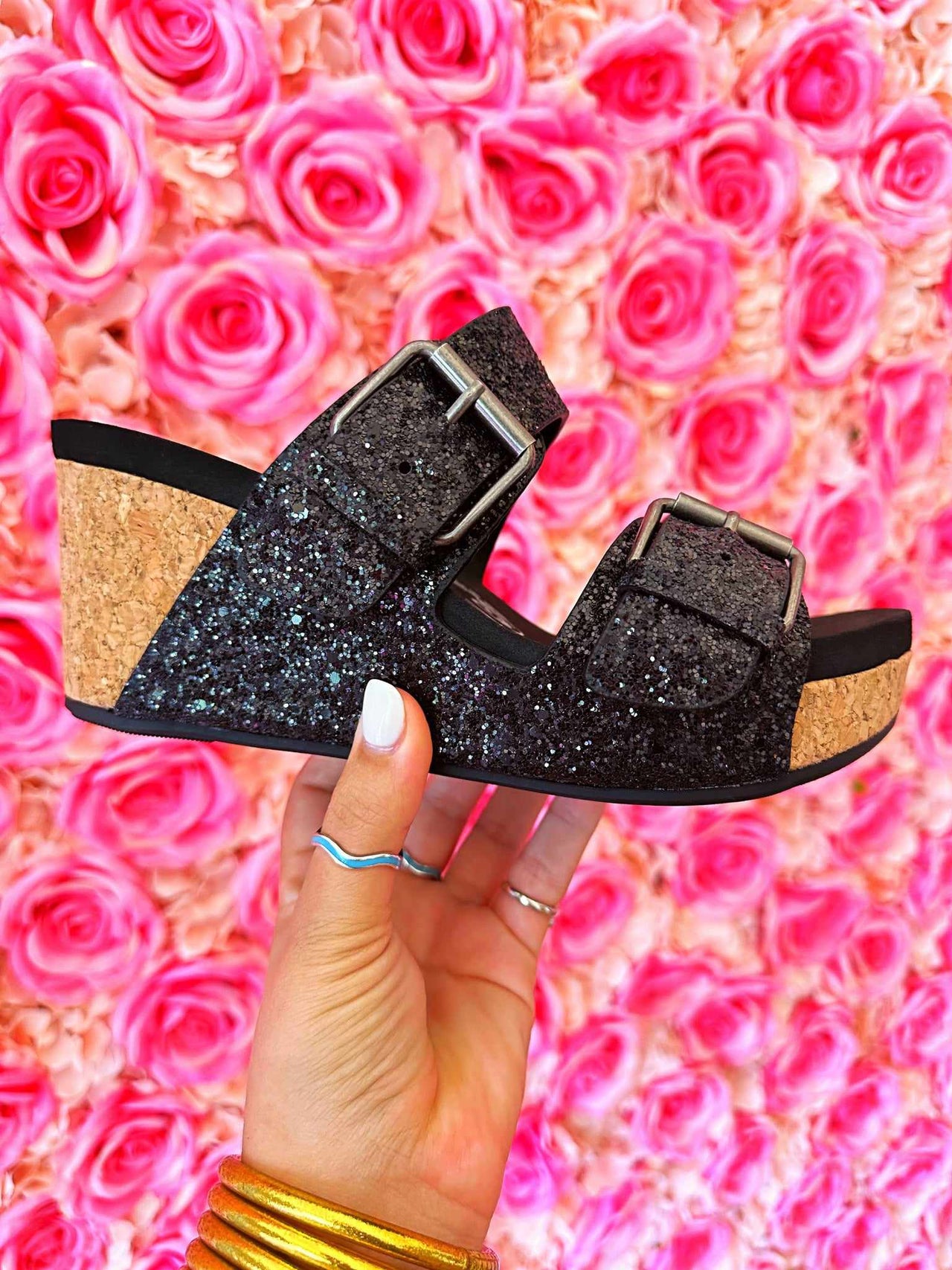 Black glitter wedge sandal for women.