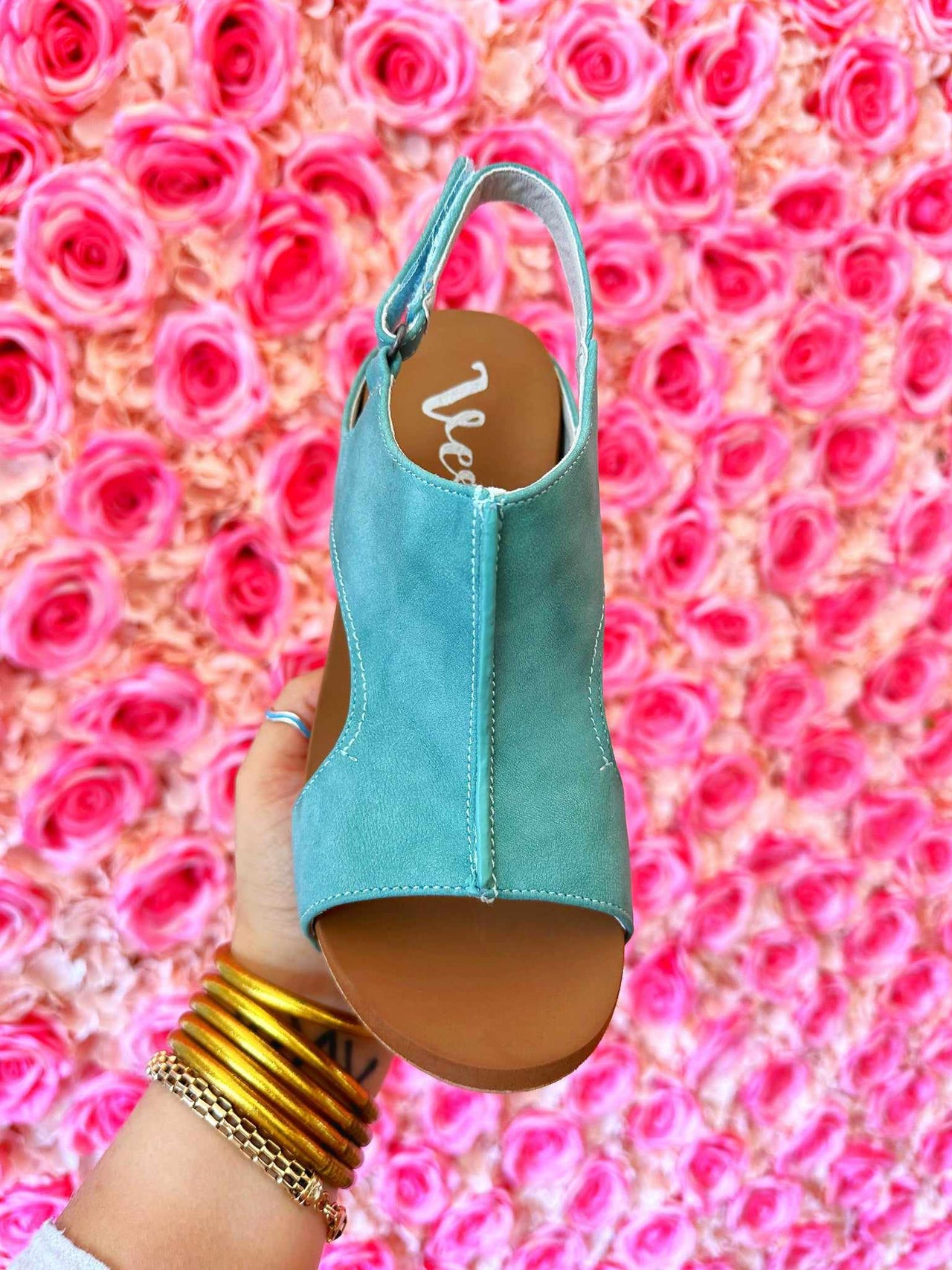 Turquoise open toe wedge slingback sandal.
