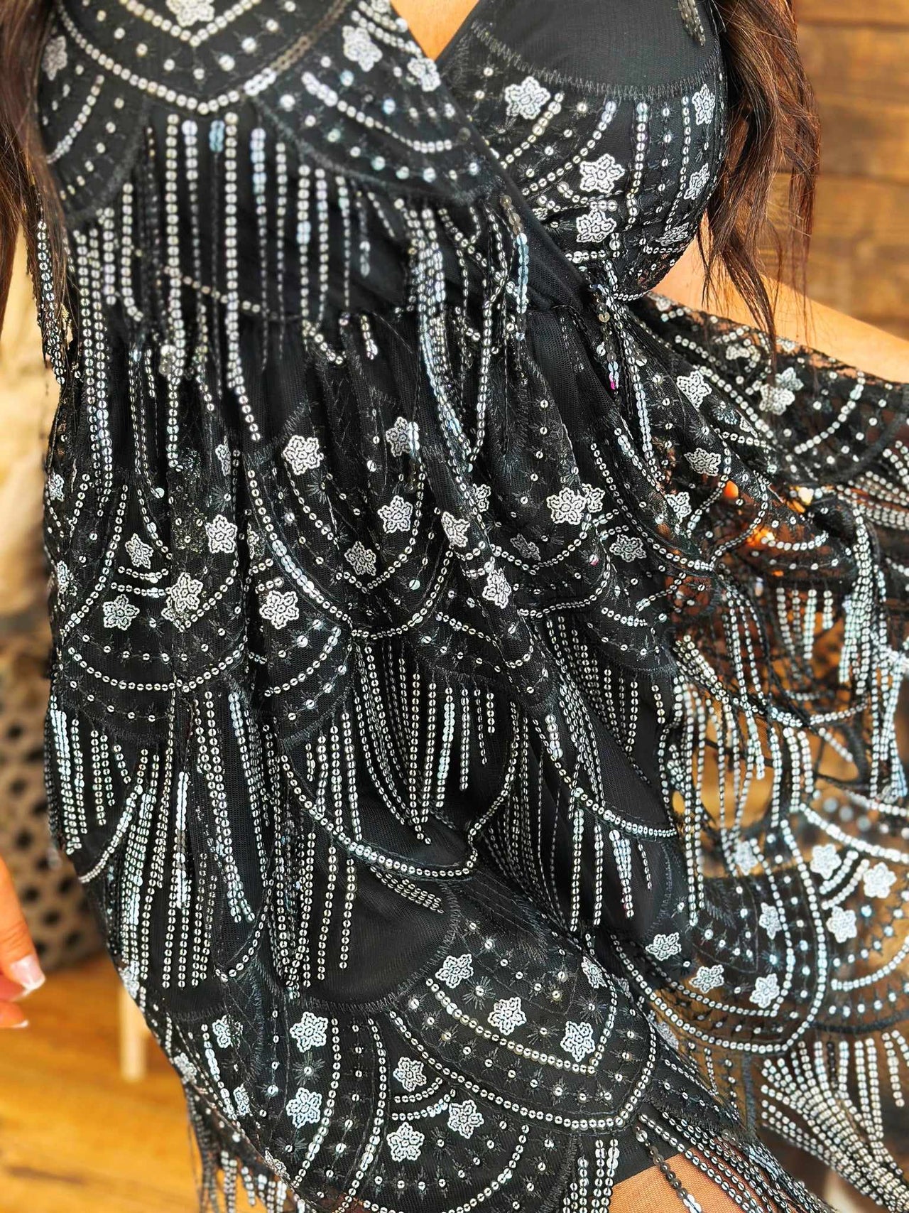 Black dress with gunmetal fringe.