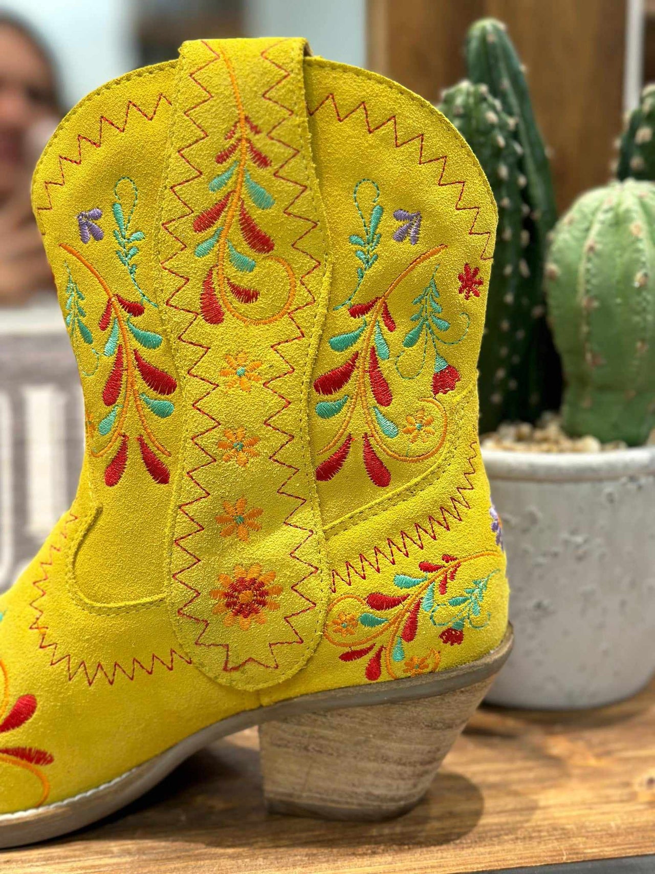 Yellow western boots with colorful embroidery