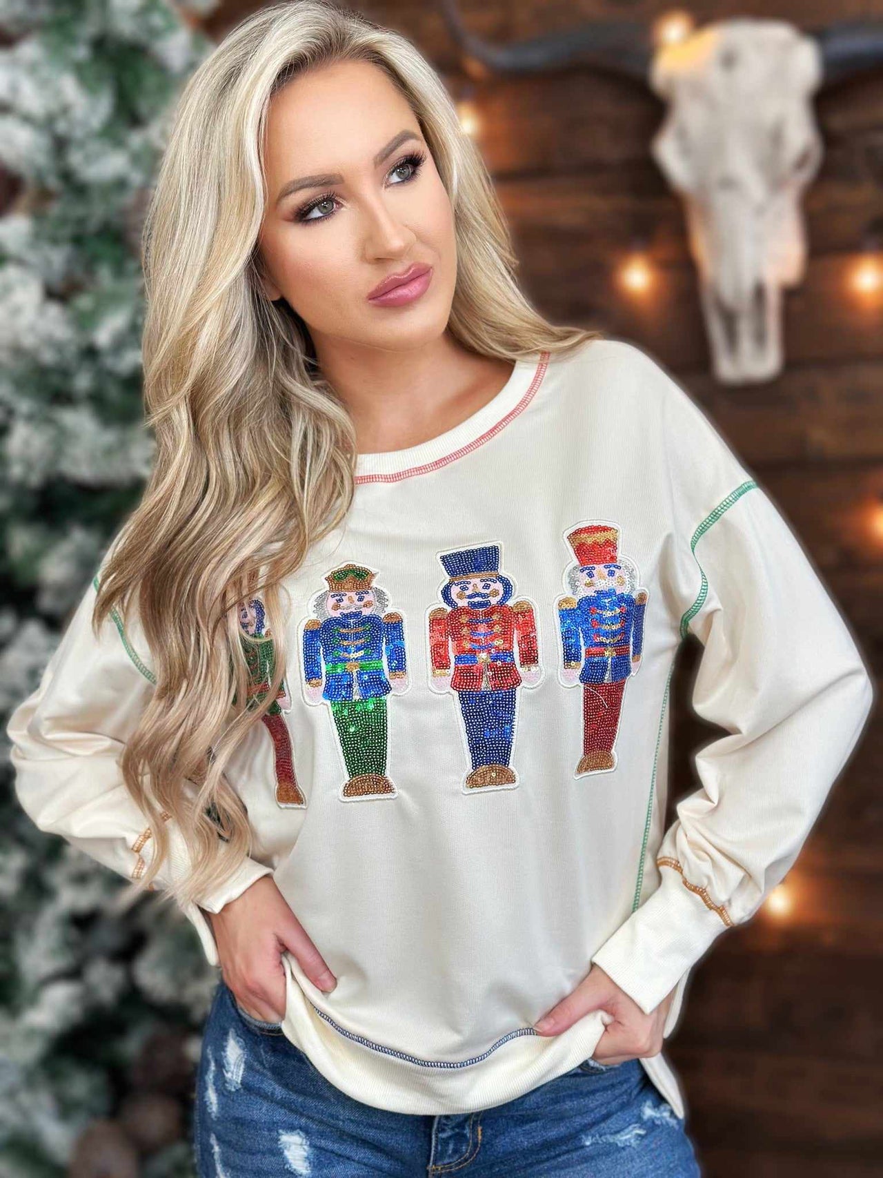 Cream holiady sweater with sequin nutcrackers