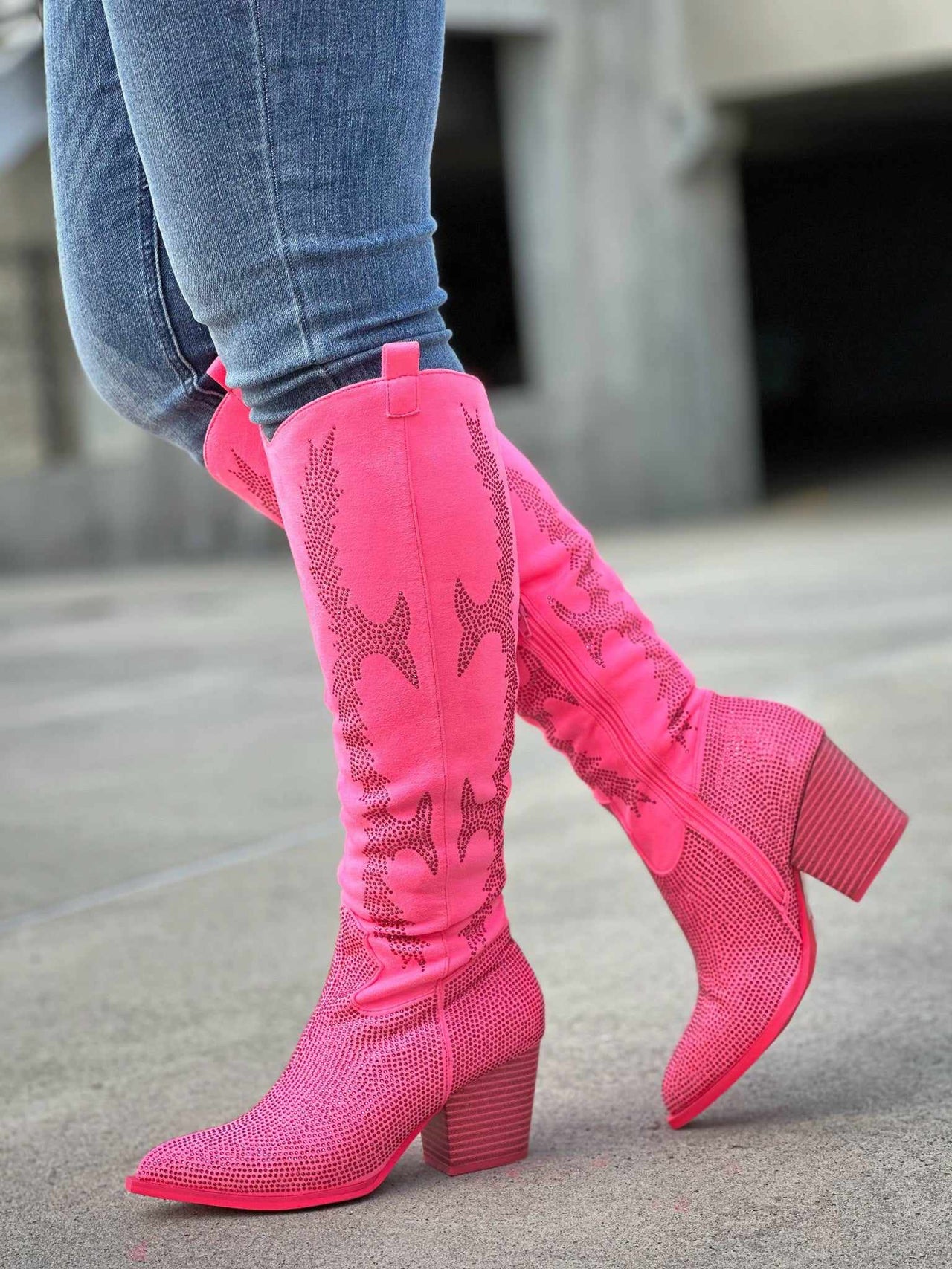 Hot pink rhinestone western boots.