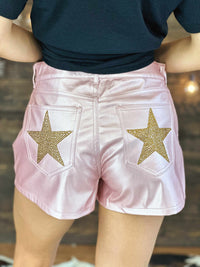 Thumbnail for Pink faux leather shorts with stars.