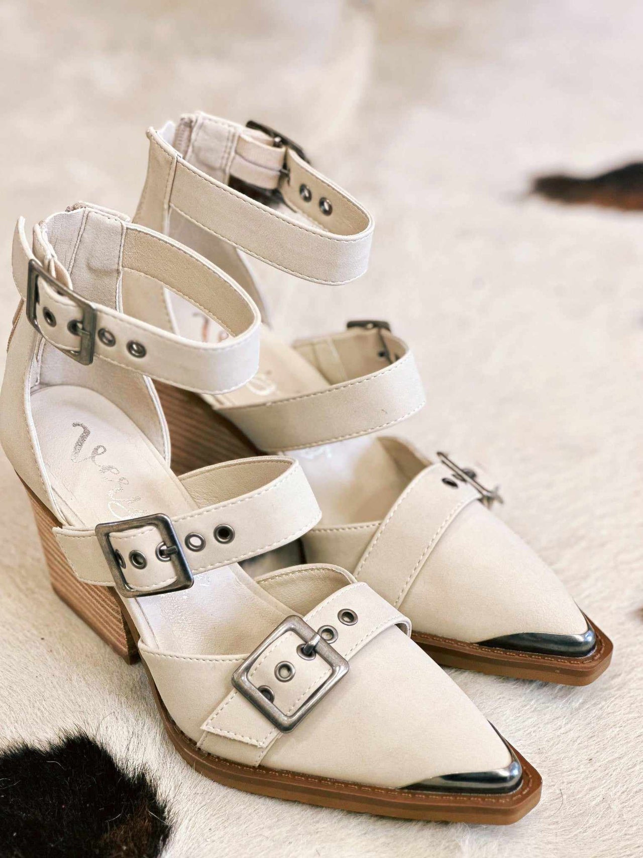 Cream double strap chunky heels with buckles.