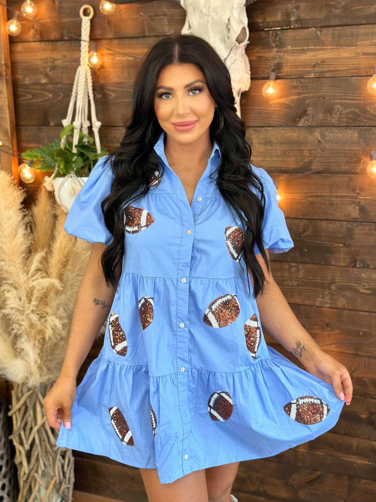 Blue tiered shirt dress with sequin footballs.