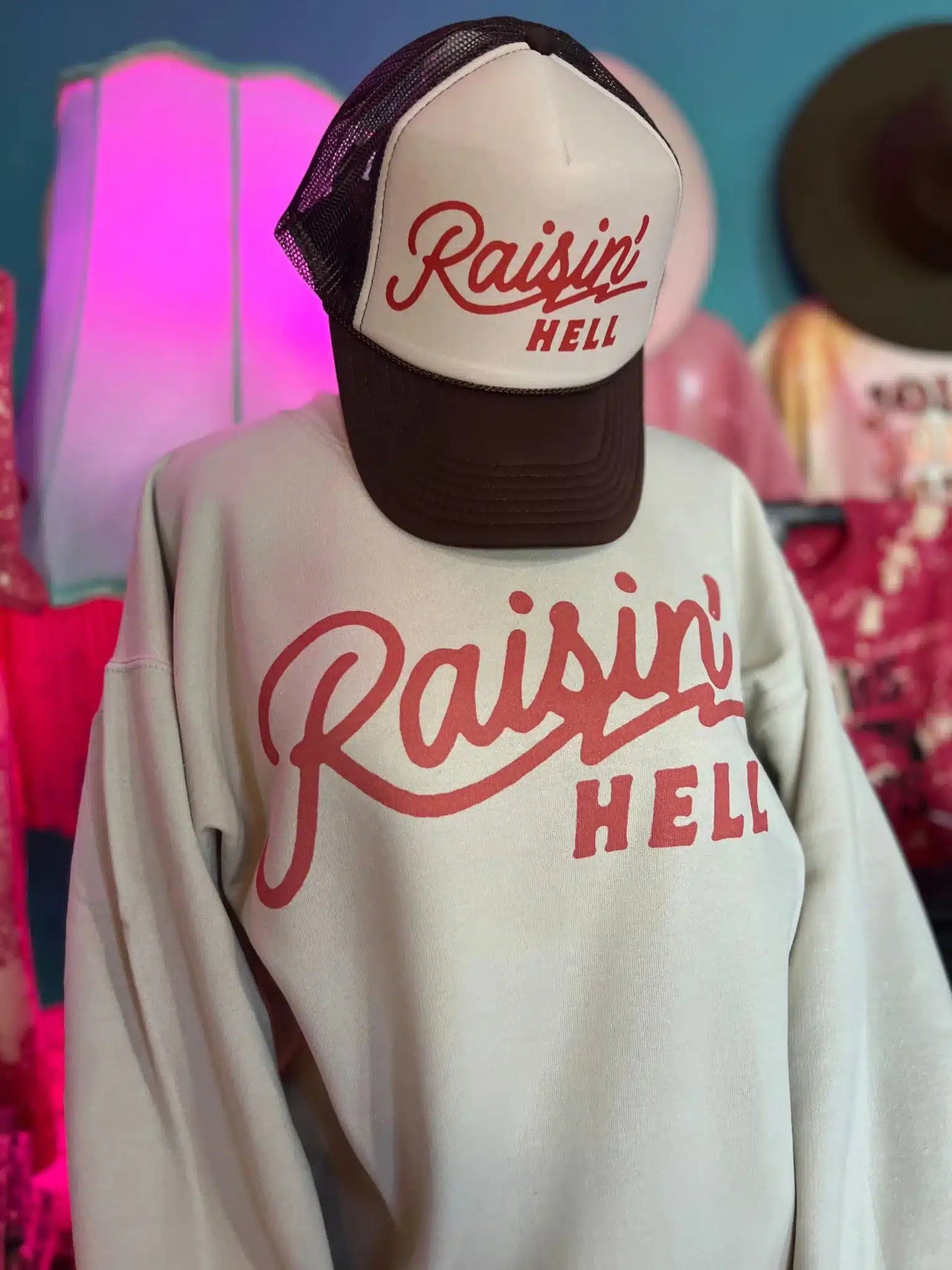 "Raisin' Hell" sweater.