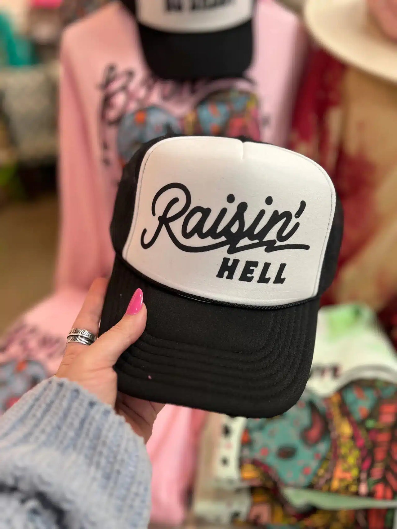 Raisin Hell Trucker Hat - Black and White