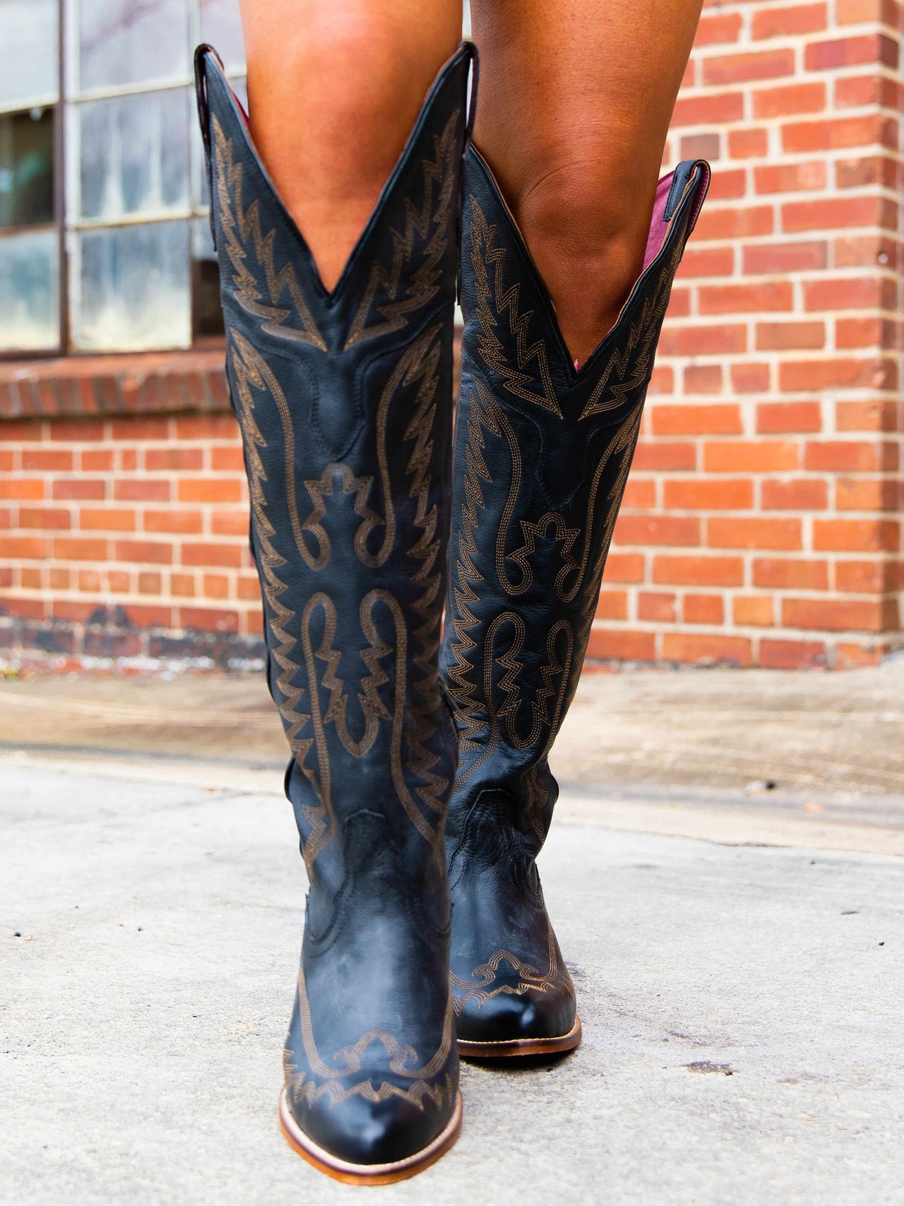 black knee-high cowgirl boots