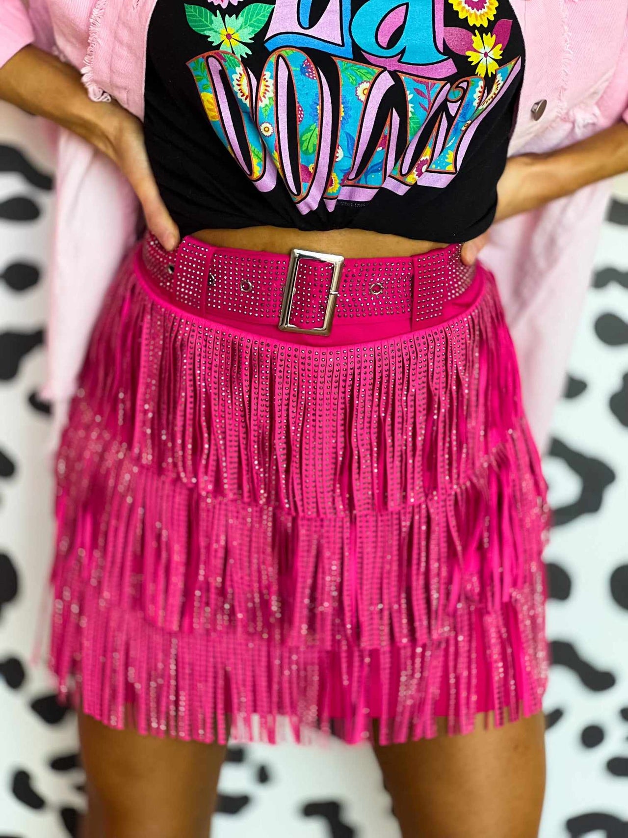 Pink mini skirt with fringe.
