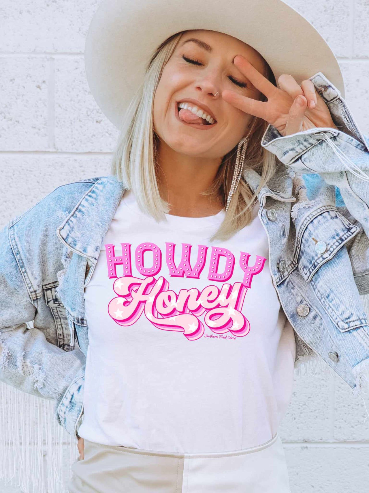 "Howdy Honey" pink and white graphic tee for women.