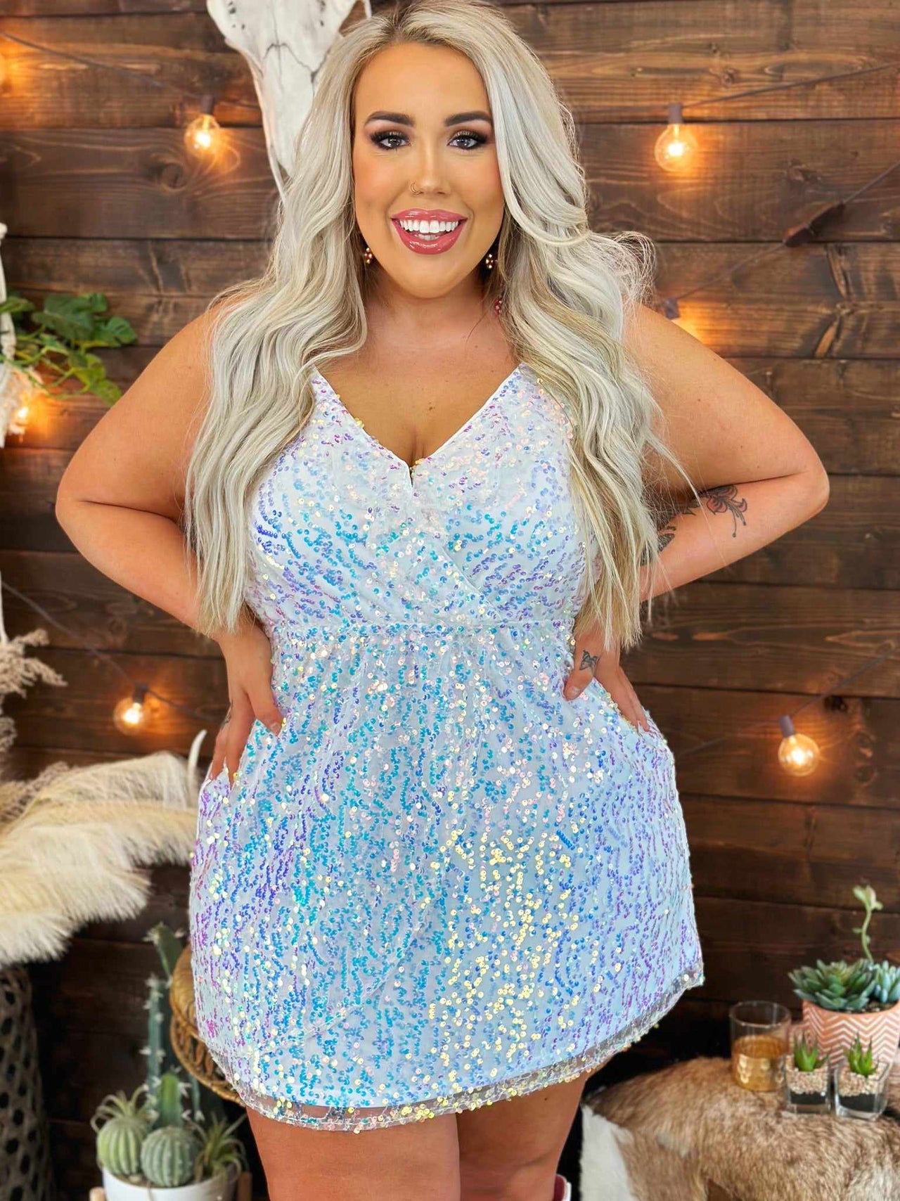 Plus size white mini dress with sequins.