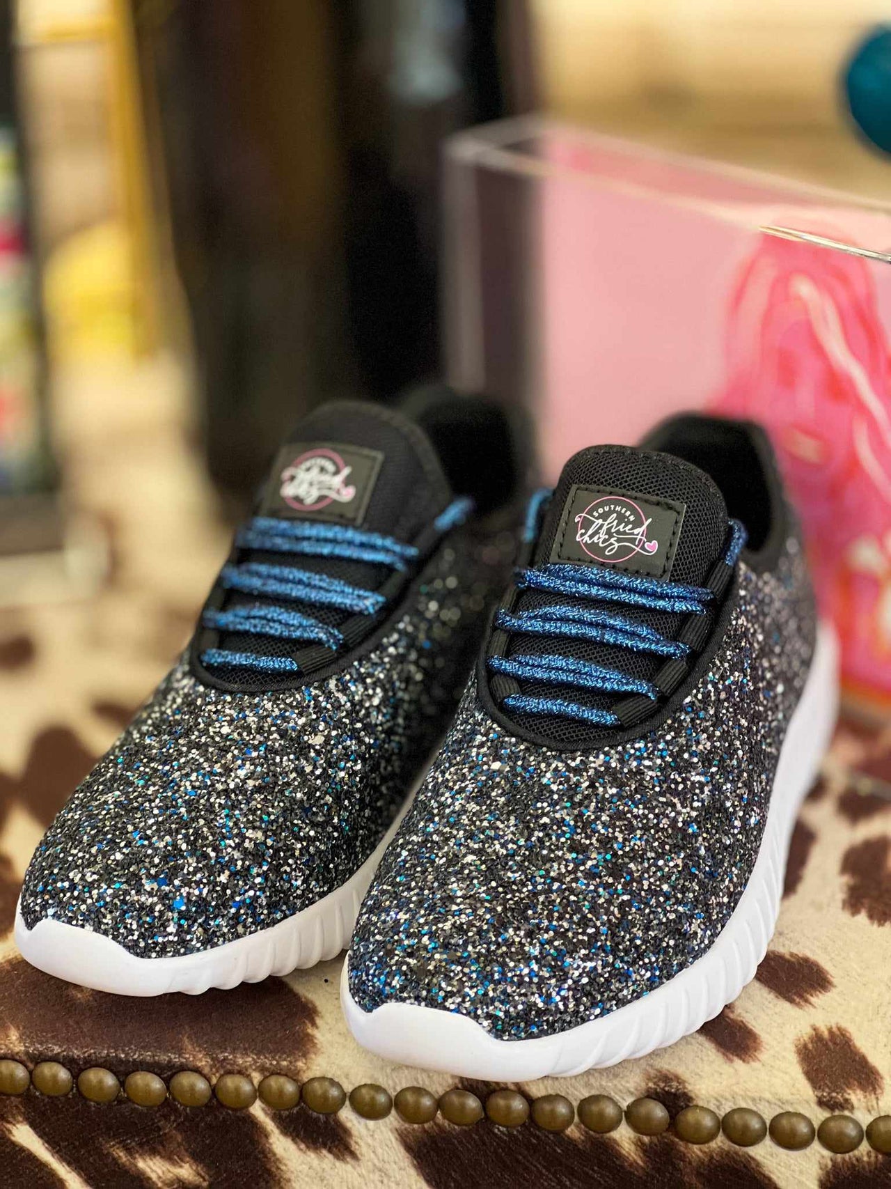 Black and blue glitter sneakers.
