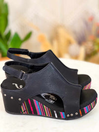 Thumbnail for Black wedge sandal with pink serape print heel.