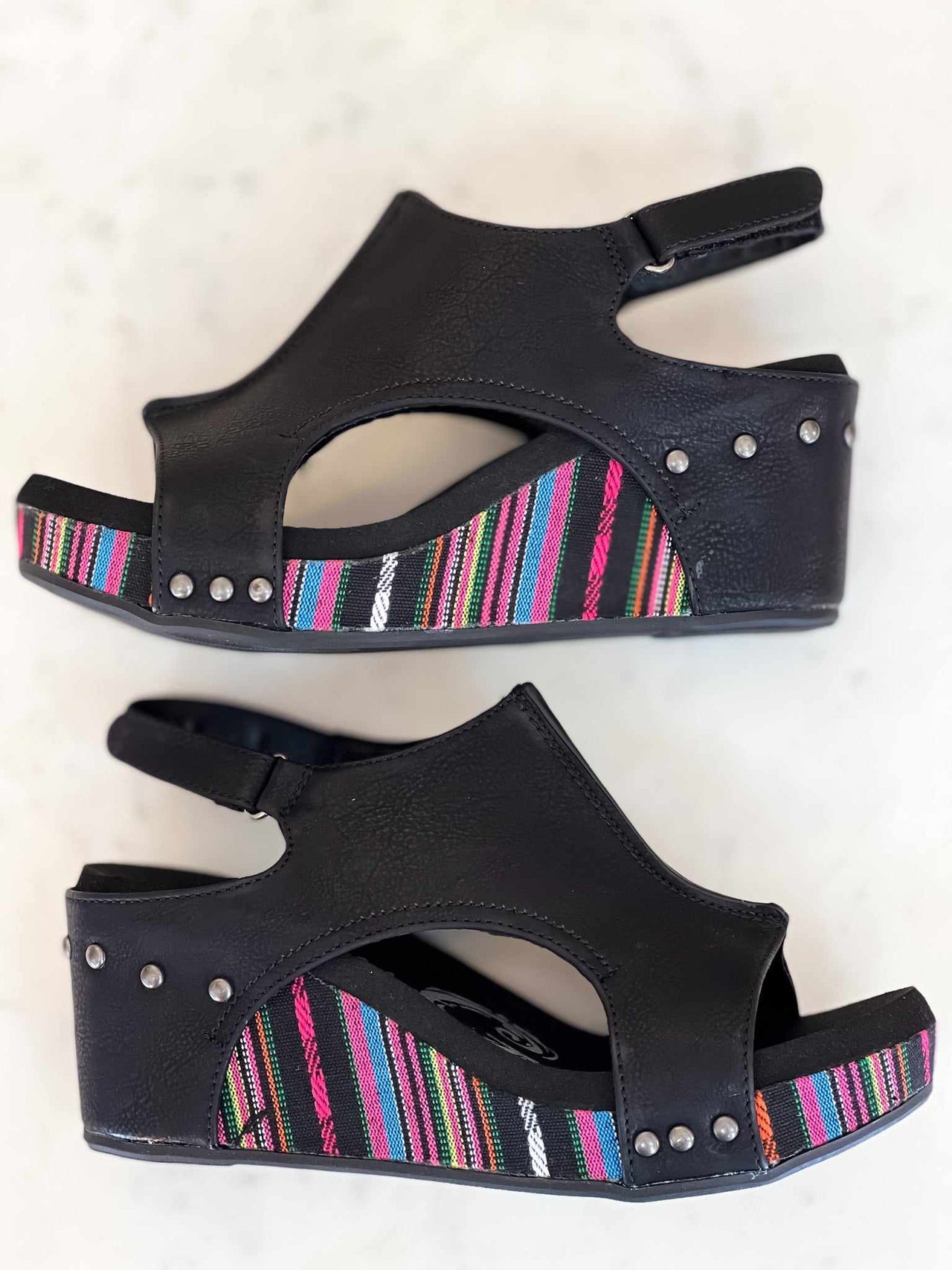 Black and pink wedge sandals.