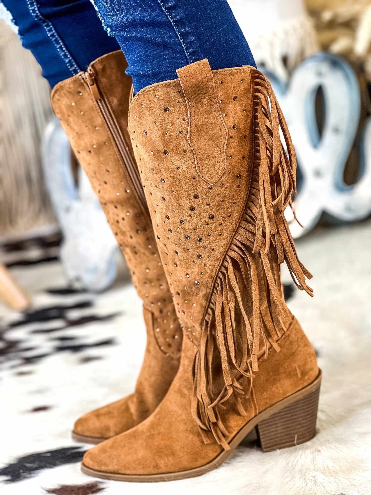 Brown suede fringe western boots.