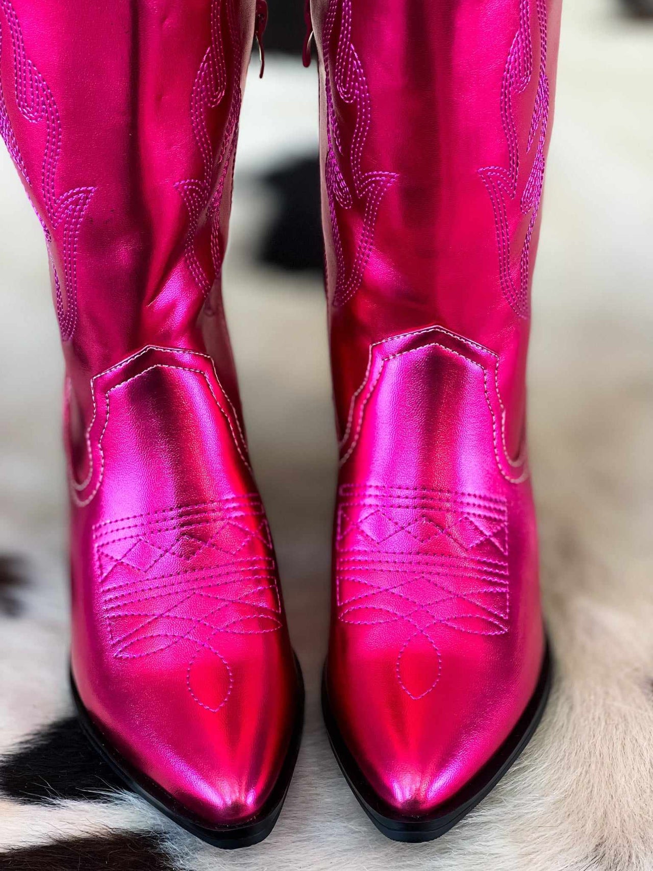 Metallic hot pink western boots.