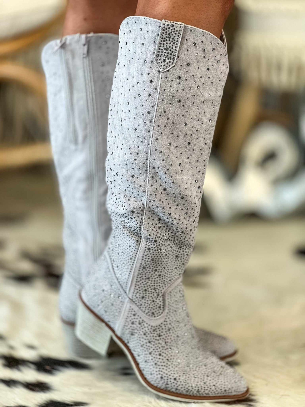 Grey knee high boots with silver rhinestones.