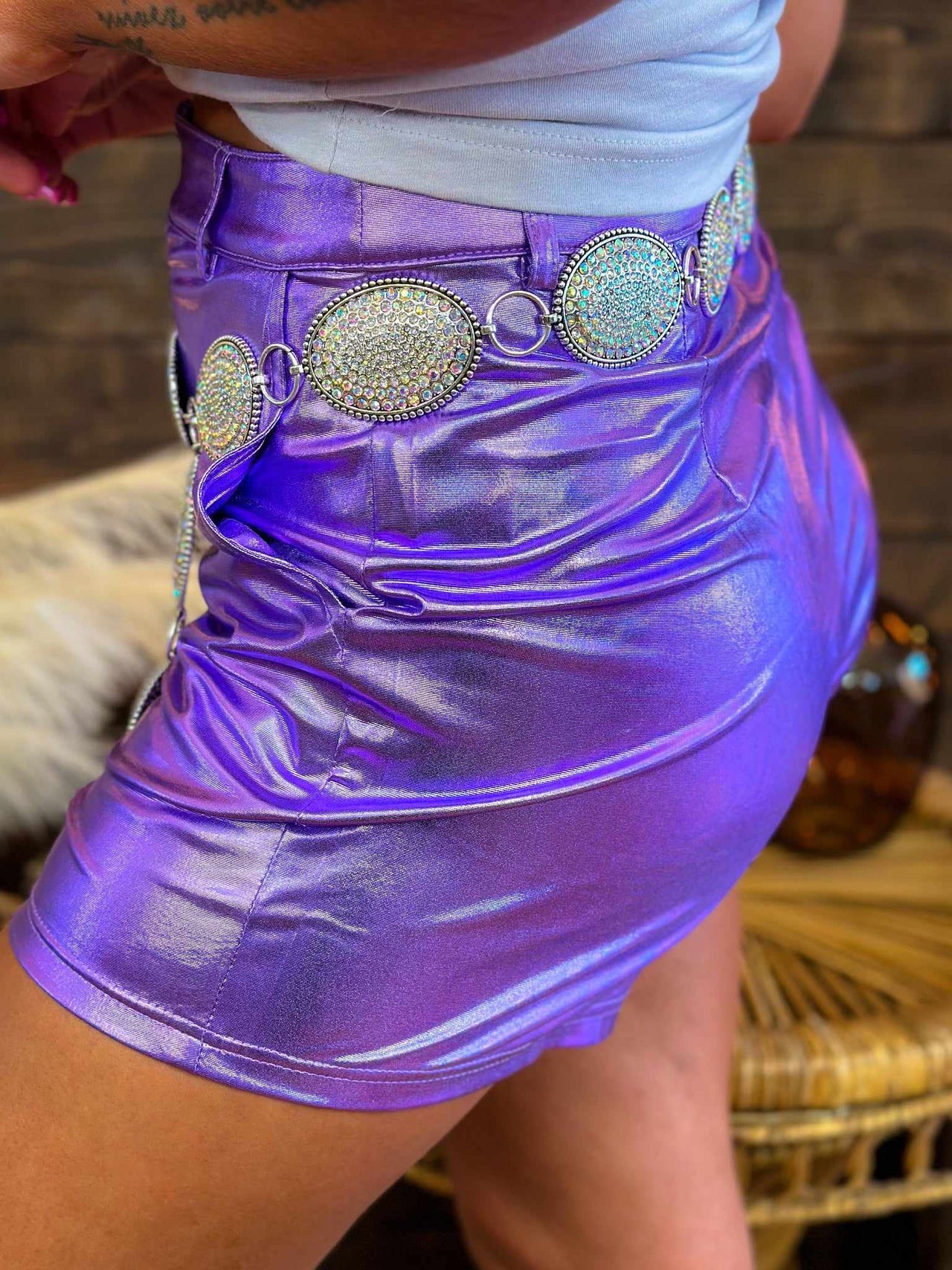 Faux leather shorts in metallic purple.