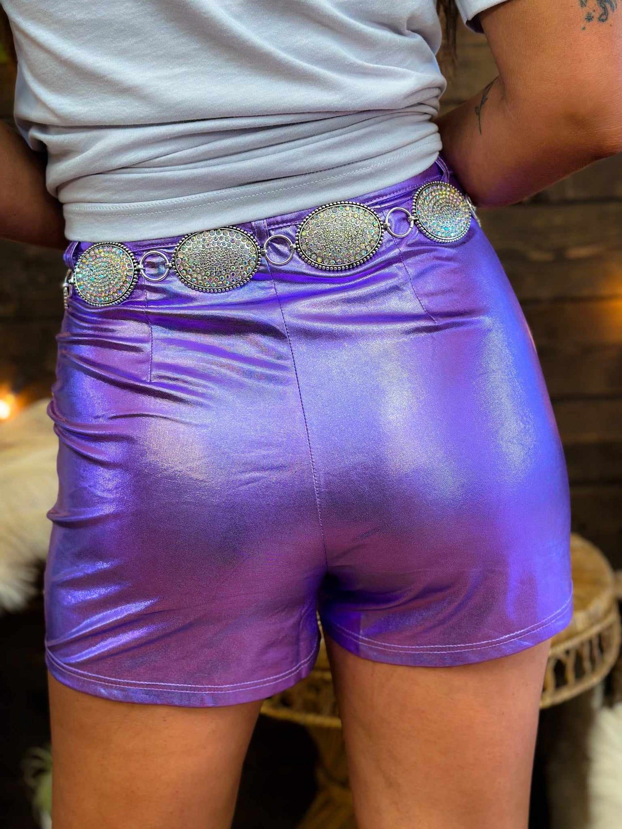 PU leather shorts in metallic purple.