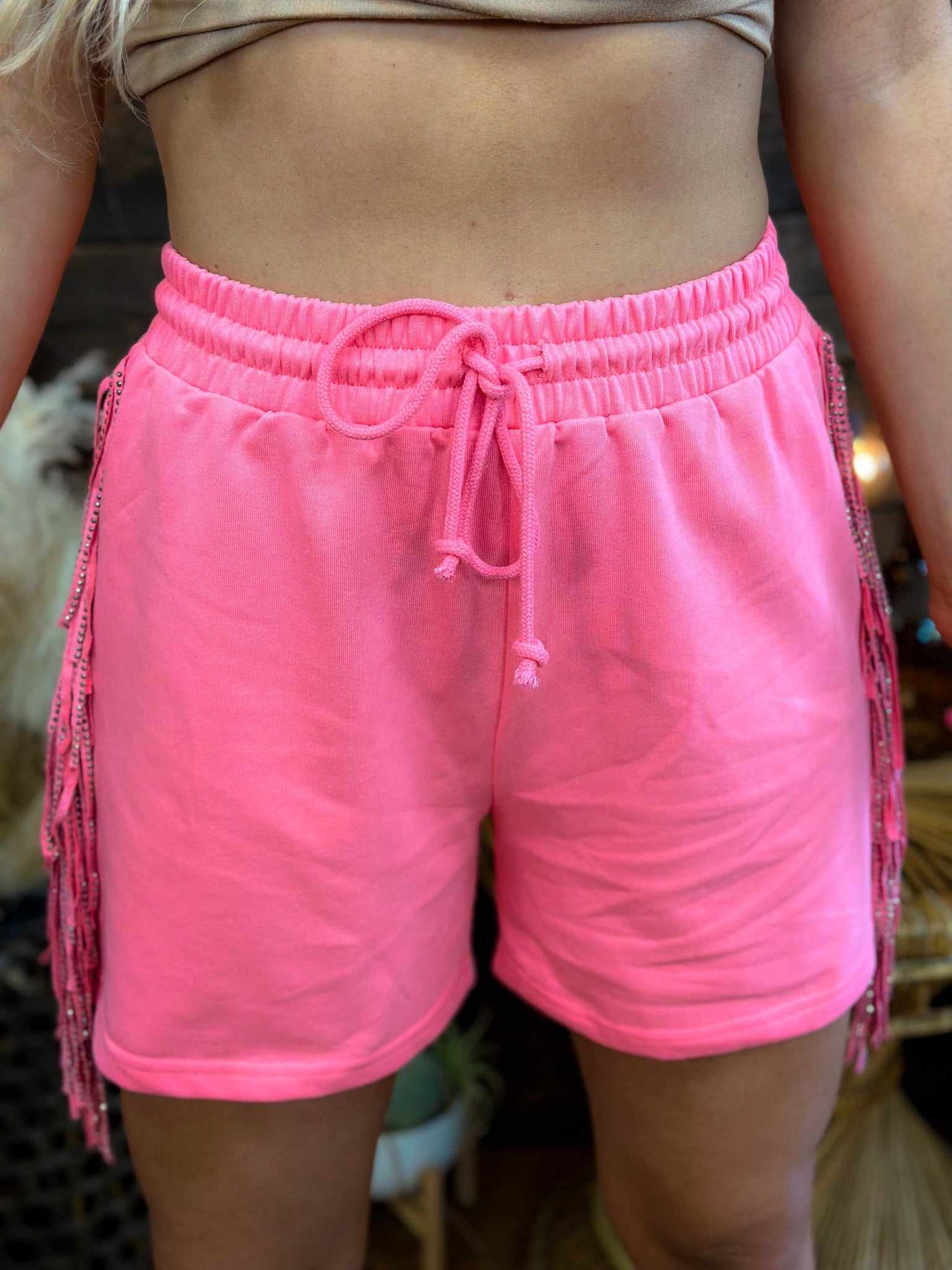 French terrycloth shorts with western style fringe in pink.