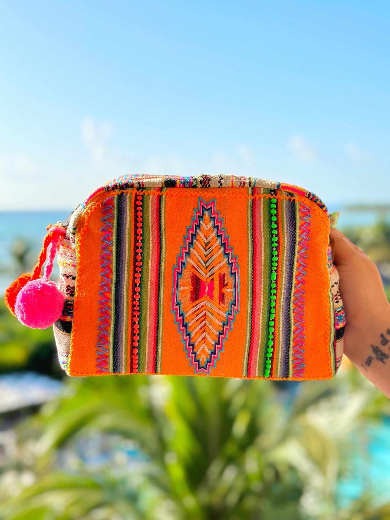 orange striped aztec print makeup bag.