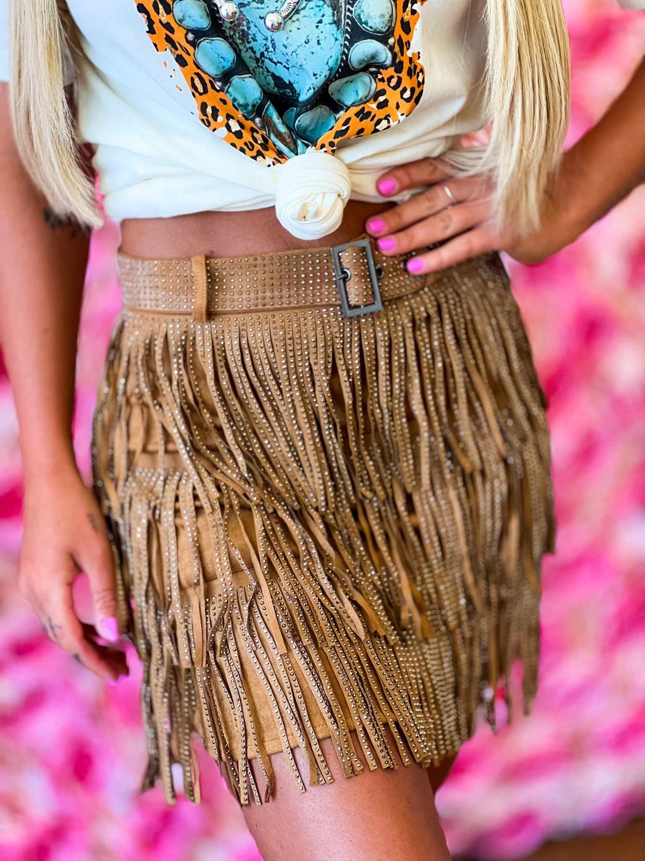 Brown mini skirt with fringe.