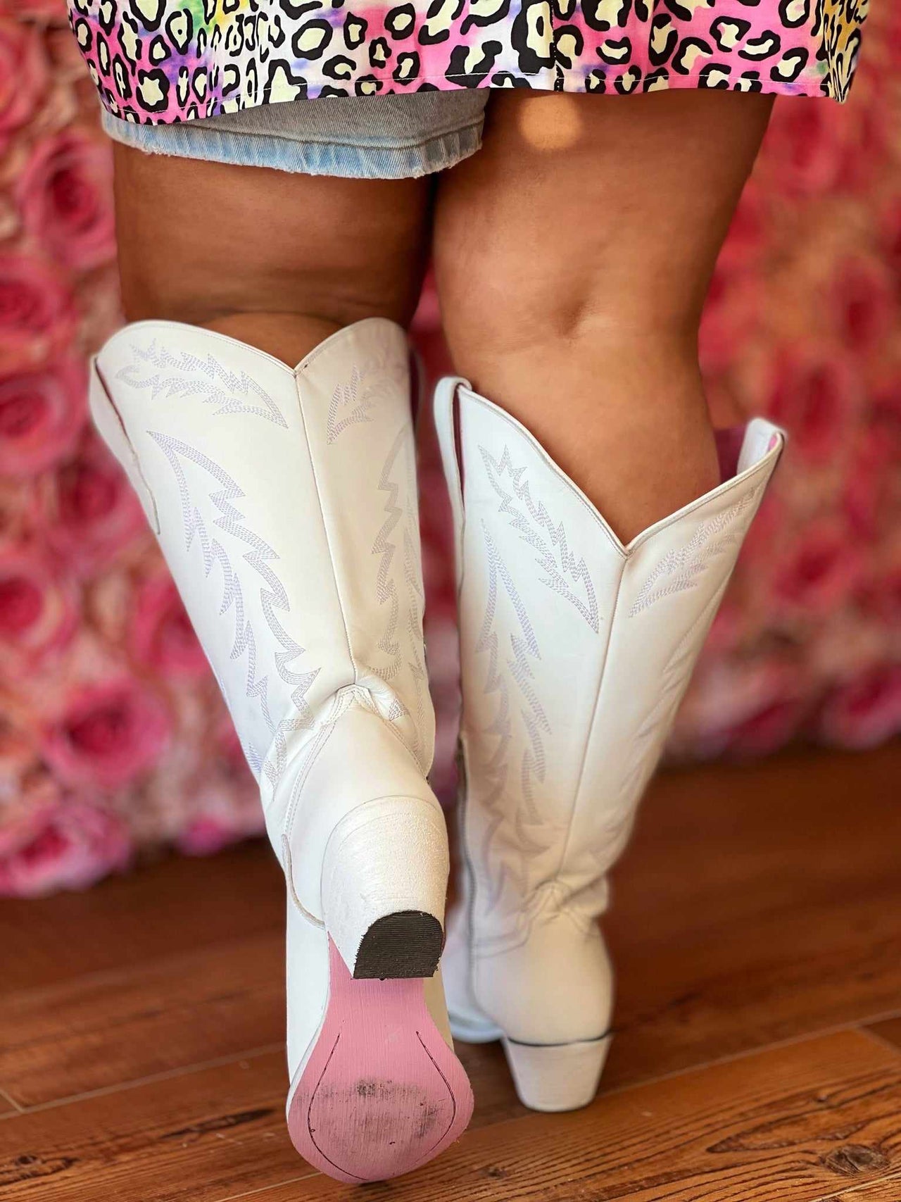 Wide calf western boots with pink soles.