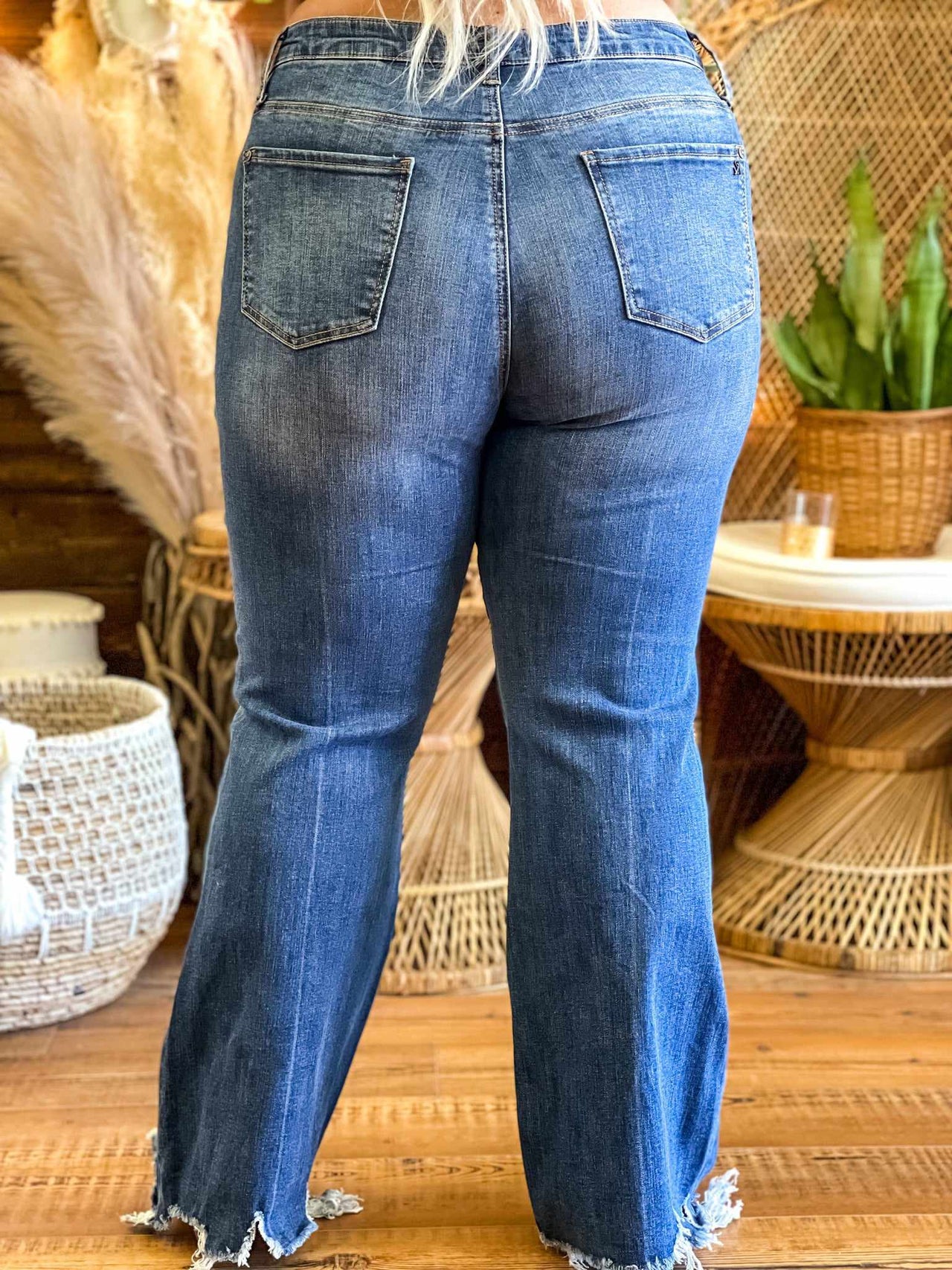 mid rise boot cut distressed blue jeans