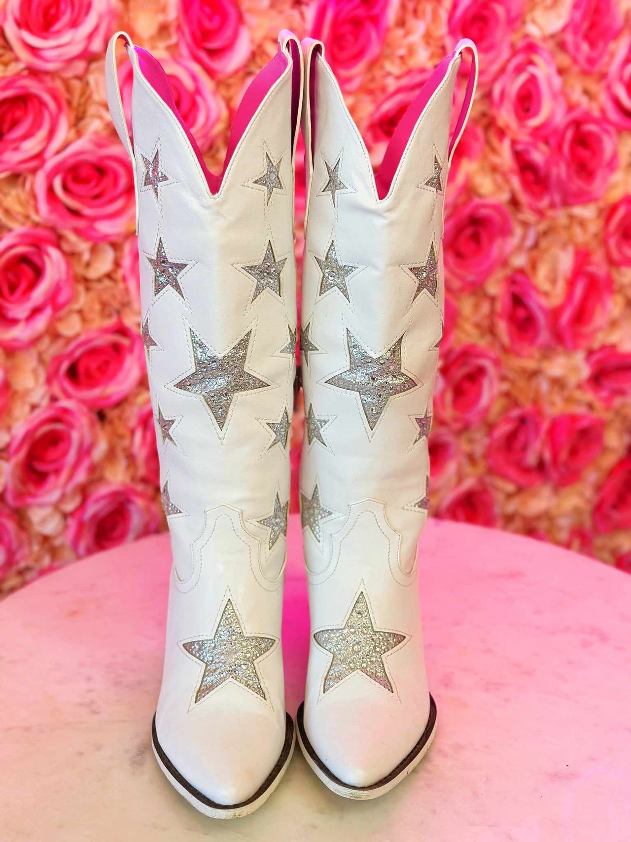 Western boots with silver stars in white.
