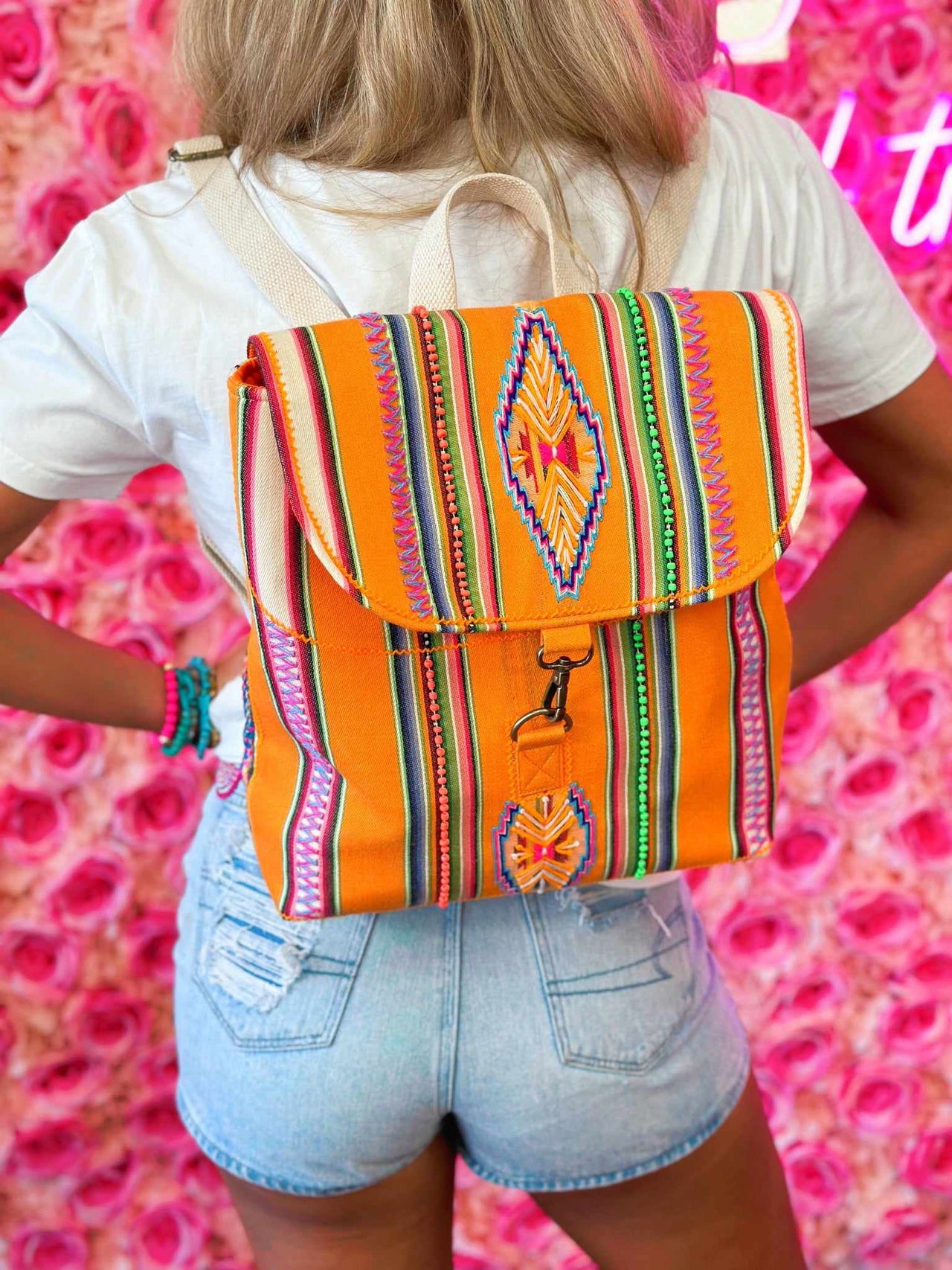 Orange striped aztec backpack purse.