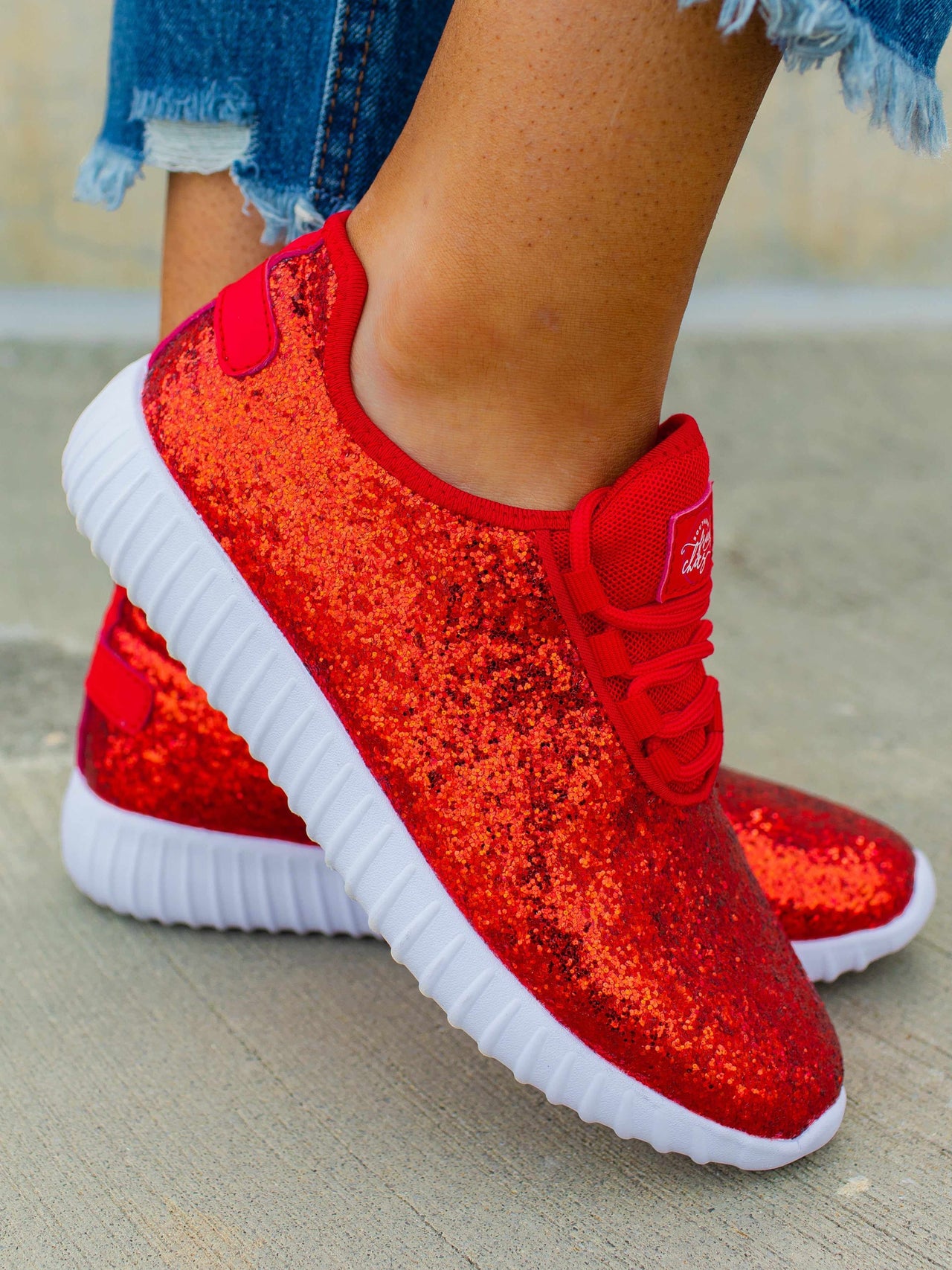 Girl Wearing A Pair Of Red Sneakers Stock Photo - Download Image Now - Girls,  2015, 8-9 Years - iStock