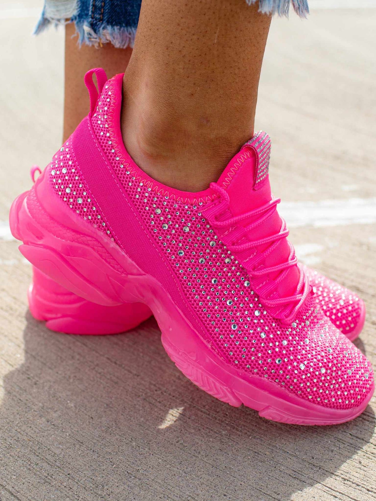 Barbiecore hot pink sneakers with rhinestones.