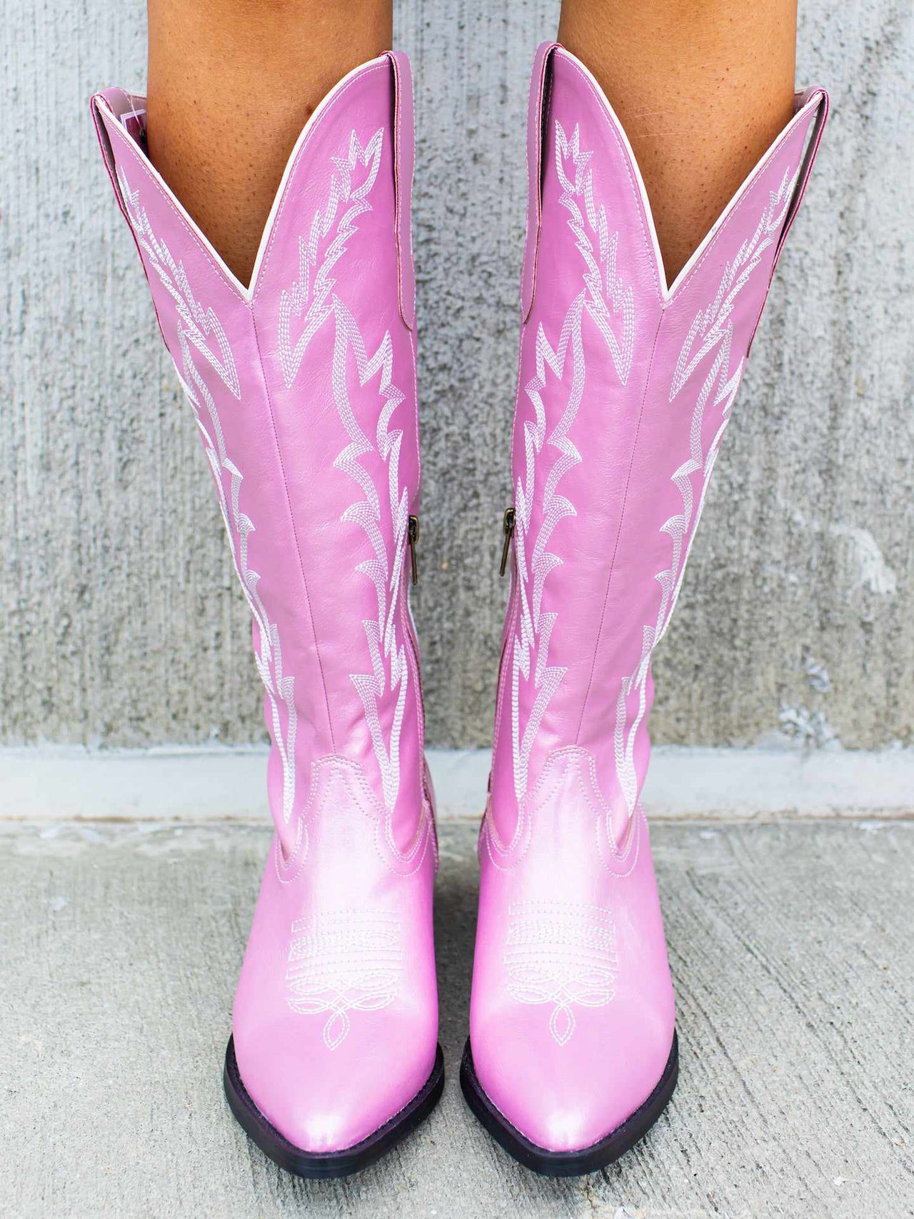 Iridescent pink western boots.